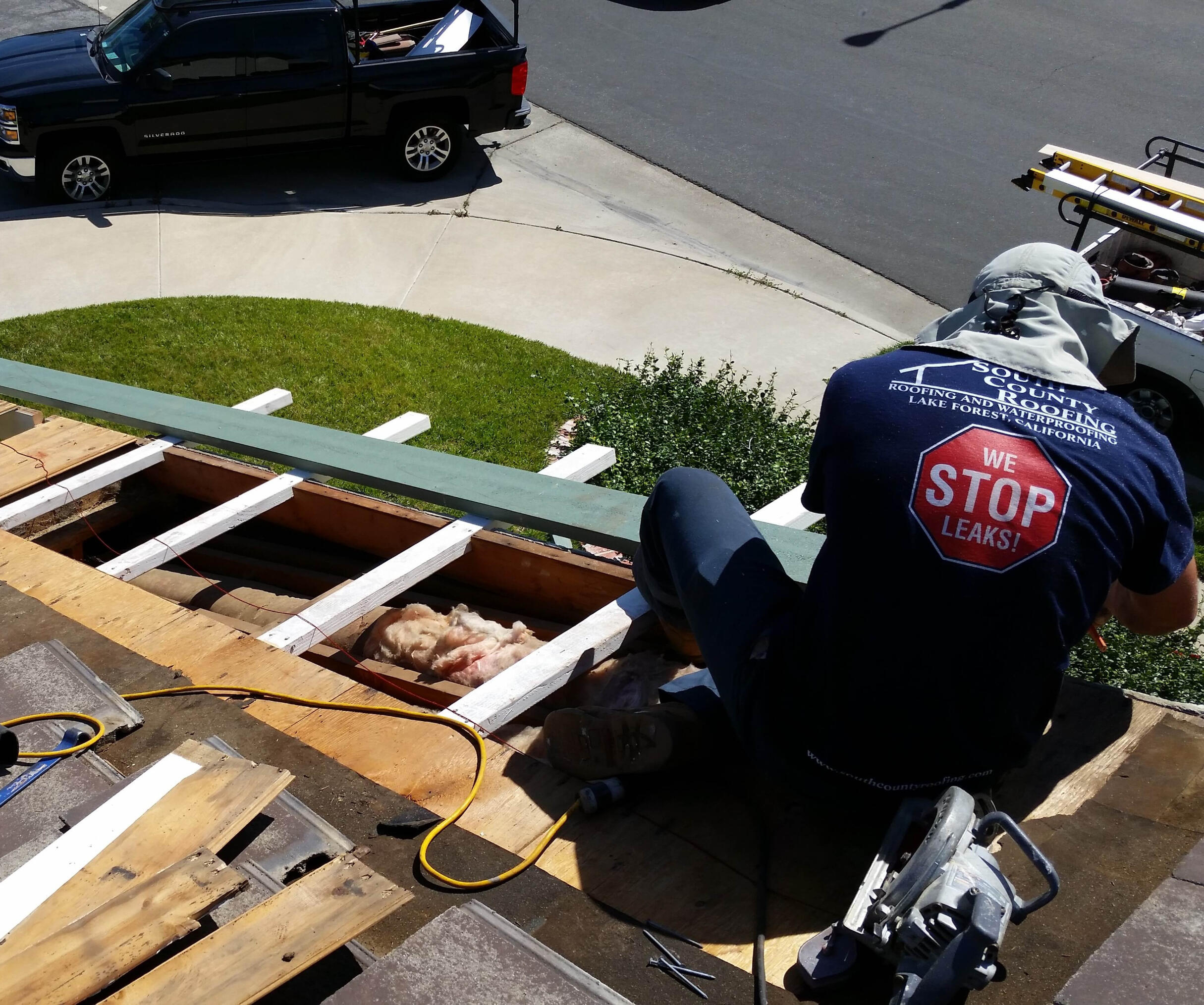 aliso viejo tile roof repair in progress roofer cutting fascia boards